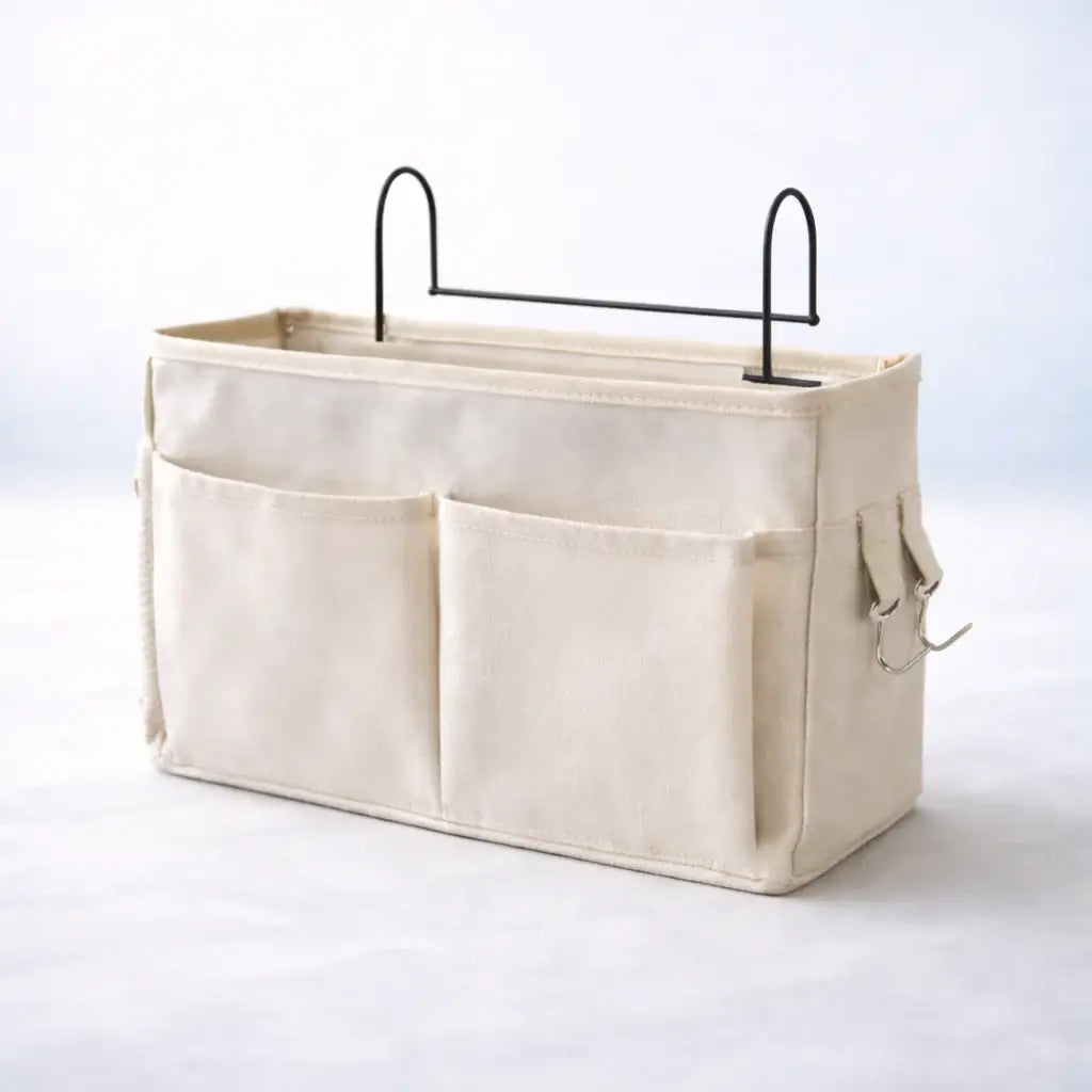 Bedside Baby Organiser – Beige fabric storage caddy with metal handles on a white background