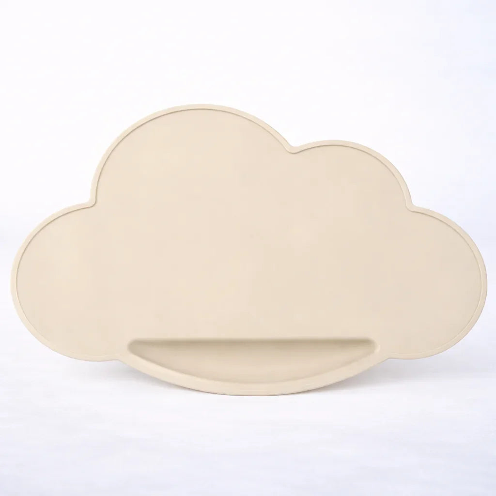 Light beige sand cloud-shaped silicone placemat on white background