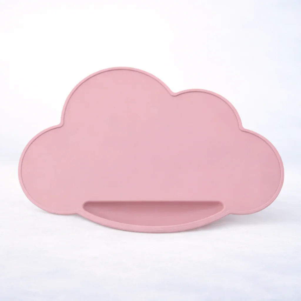 light pastel pink cloud-shaped silicone placemat on a white background