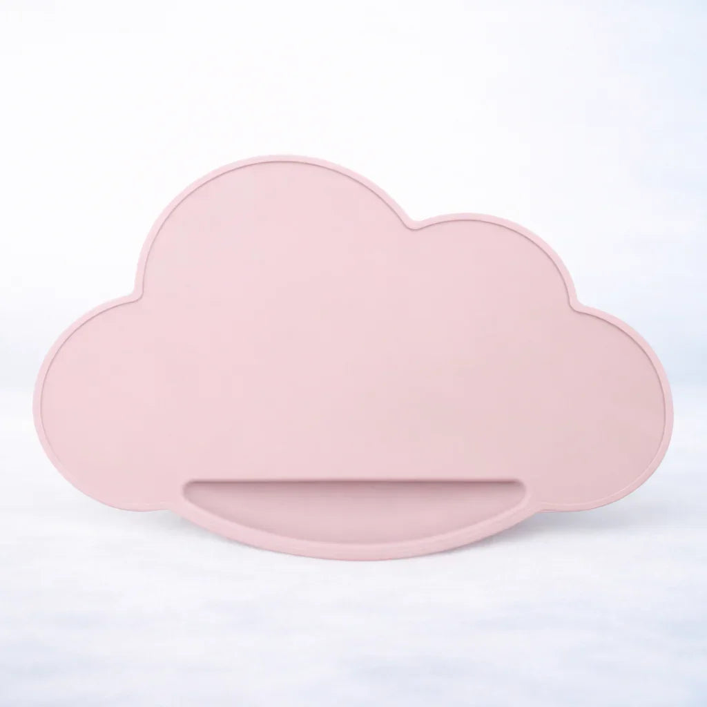 Pink cloud-shaped silicone placemat on a light background, kids tableware accessory