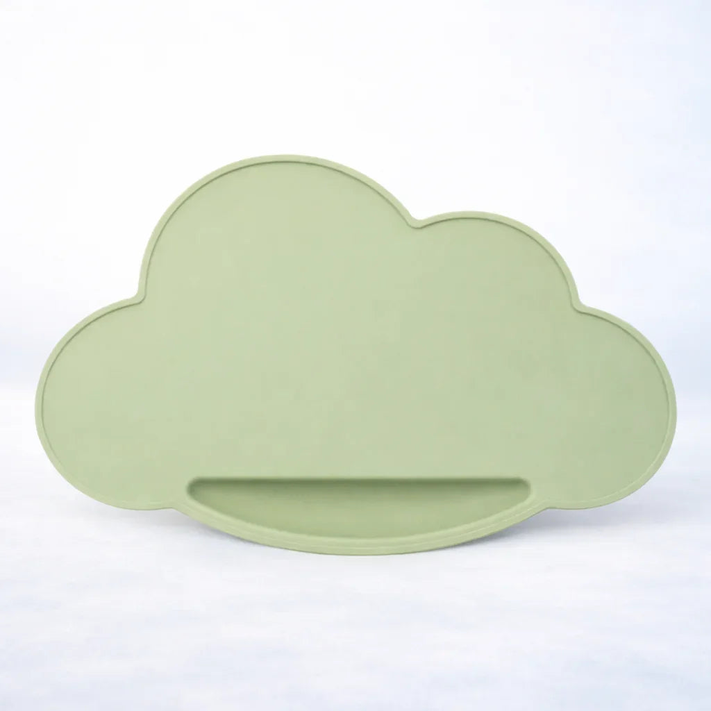 Sage green silicone cloud-shaped placemat on white background