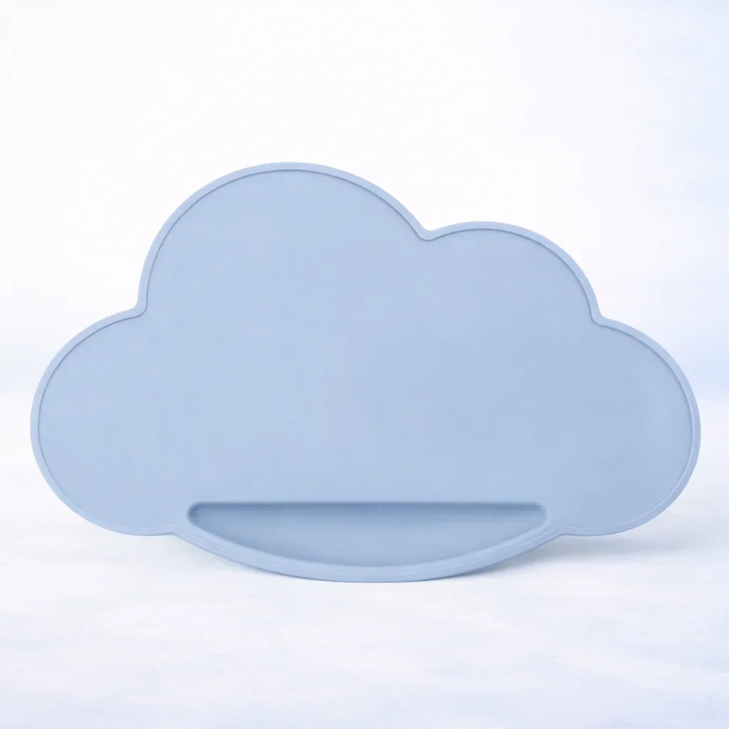 cloud-shaped soft powder blue silicone placemat on white background