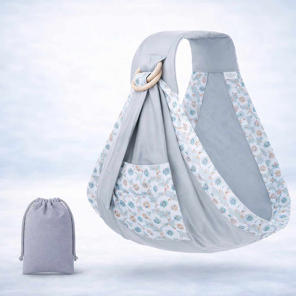 Embrace Wrap™ baby wrap newborn sling in grey with floral accents, shown with matching carrying pouch.