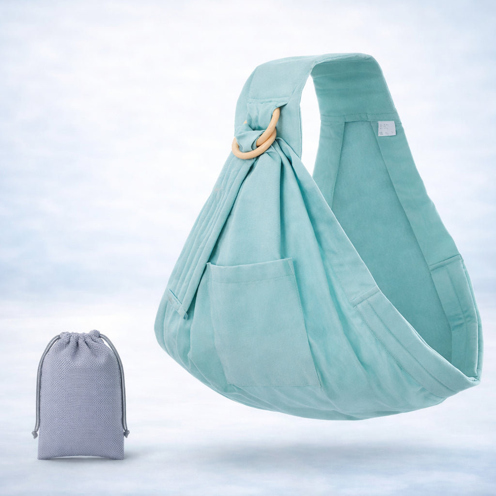 Embrace Wrap™ baby wrap newborn sling in soft teal with matching pouch, designed for ergonomic and comfortable carrying.