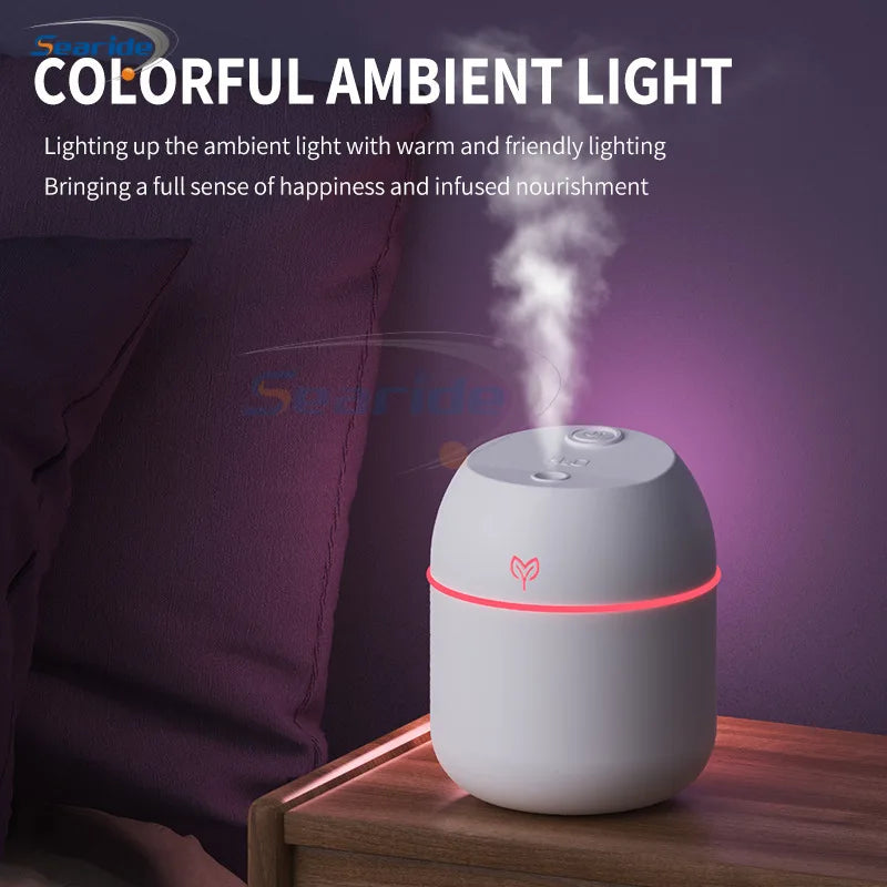 mini usb humidifier diffuser in white with red ambient light, placed on a wooden surface against a dark background for calming nighttime use.