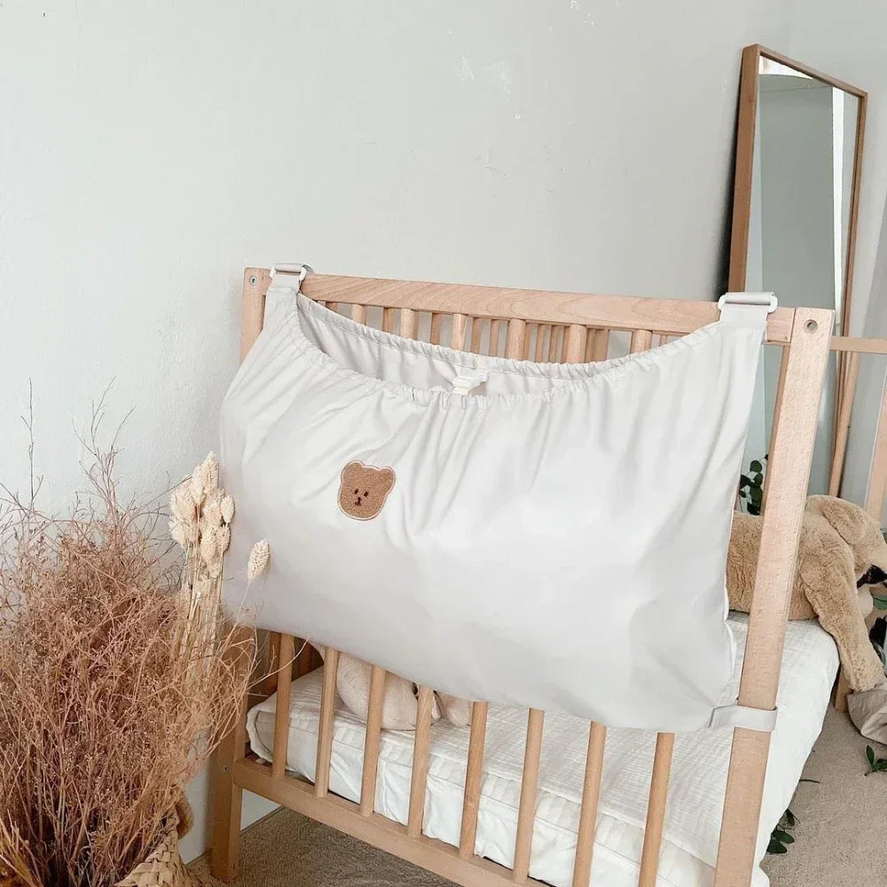 Reusable Stroller Pouch - Nursery crib with white storage organizer featuring cute bear patch, cozy minimalist decor