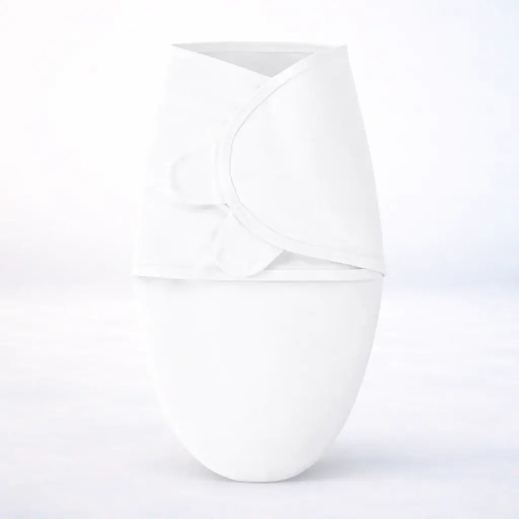 White newborn adjustable swaddle providing a secure sleeping environment for infants with soft, breathable cotton.