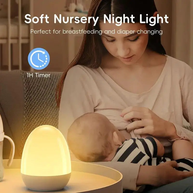 Portable touch egg lamp providing soft ambient light for breastfeeding mother in calm nursery setting.