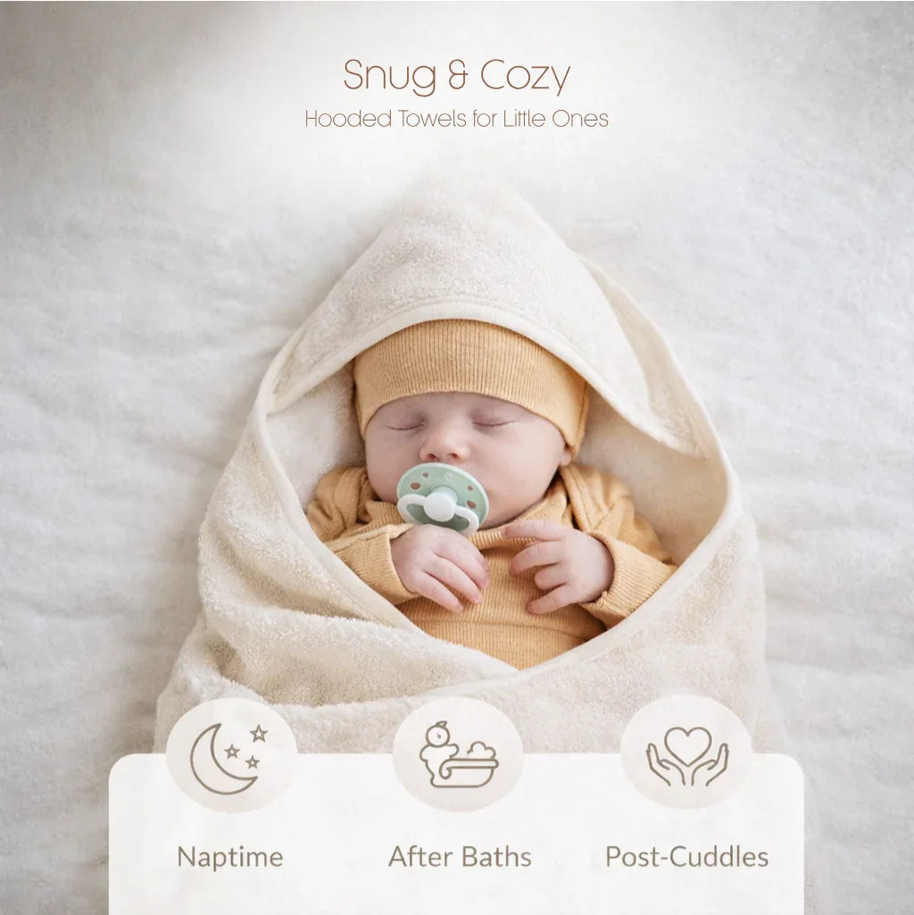 Baby wrapped in Soft Wrap™ baby hooded towel, providing gentle comfort and warmth after bath time.