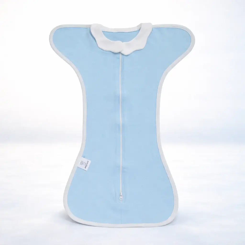 The Sleep Nest - Light blue newborn sleep sack with white edges, featuring a dual-use design for nursing and baby wrapping. Made of breathable cotton.