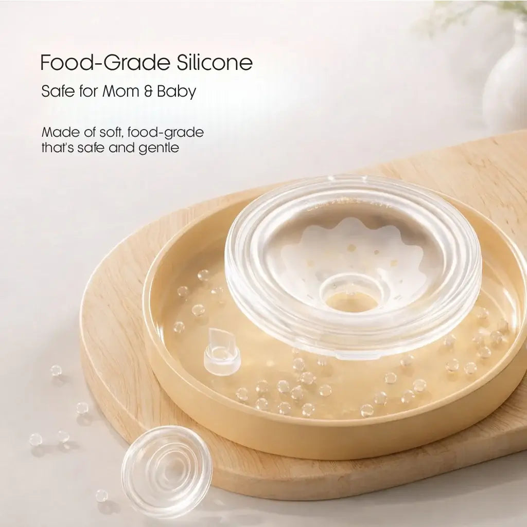 Wearable Breast Pump - Food-grade silicone lid on a wooden surface with text about safety for mom and baby.