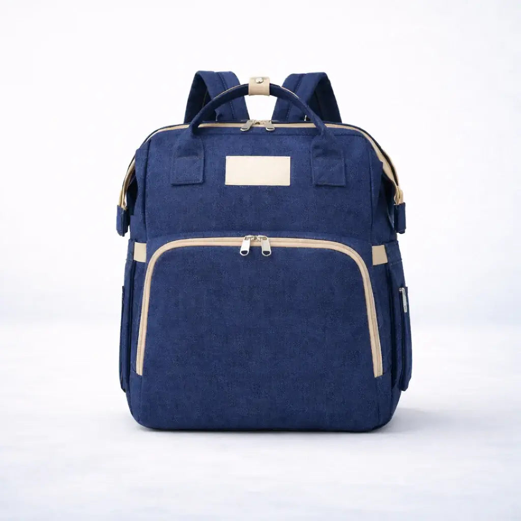 The All-In-One Diaper Bag Navy blue backpack with beige accents on a white background