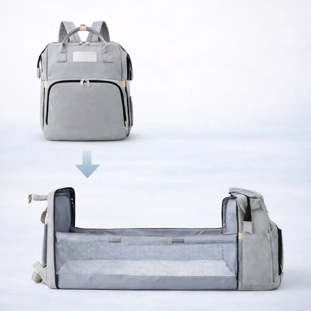The All-In-One Diaper Bag Gray backpack transforming into a bed on a light blue background