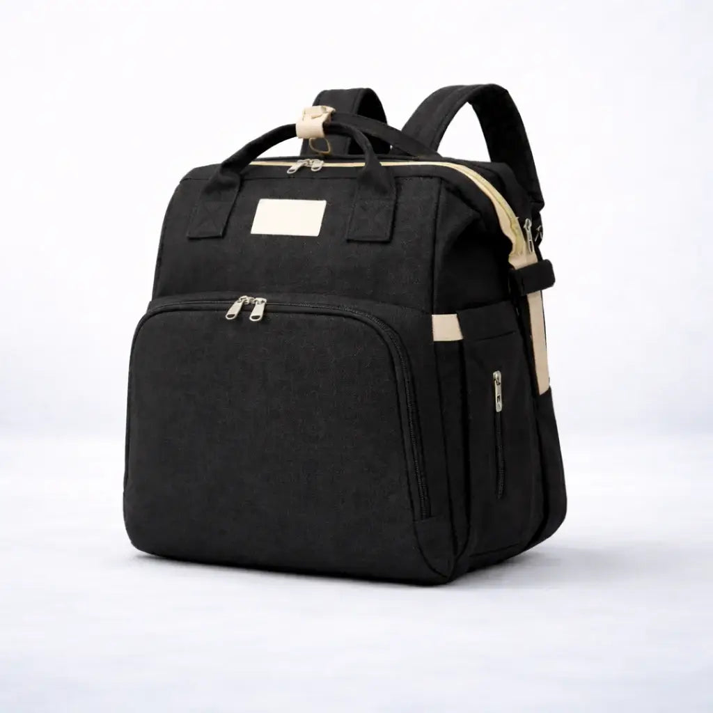The All-In-One Diaper Bag Black backpack with beige accents on a white background
