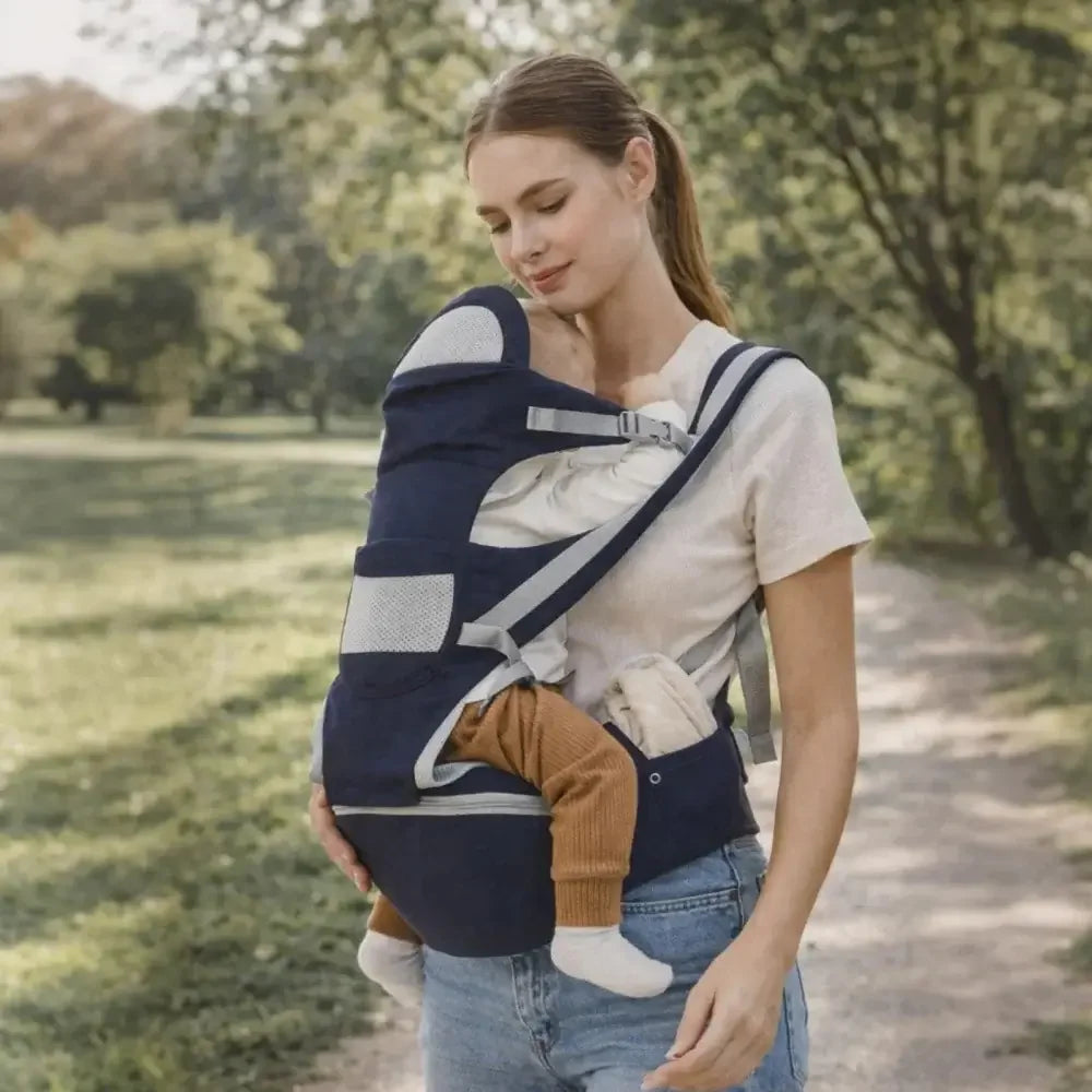 Woman wearing ergonomic adjustable baby carrier outdoors, hands-free baby carrying