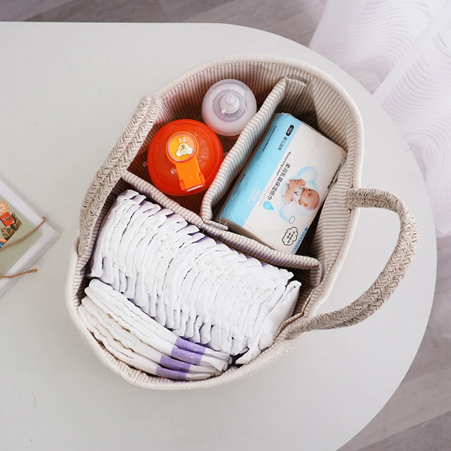 Cotton rope diaper basket top view showing organized baby items