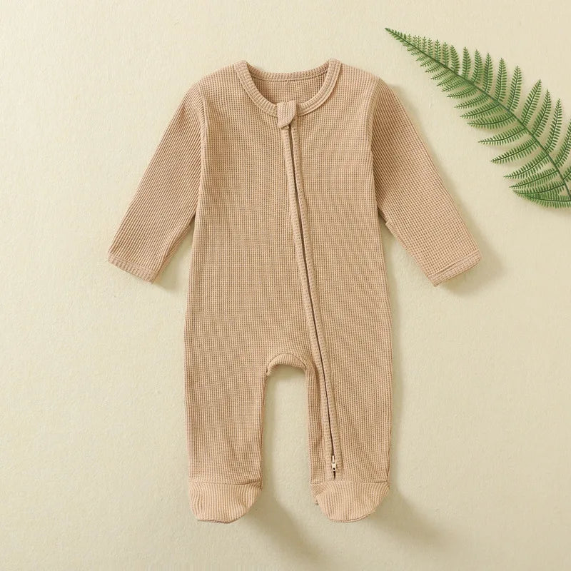 Organic Ribbed Zip Baby Romper in beige designed for soft everyday wear with 100% natural cotton and easy one-piece design