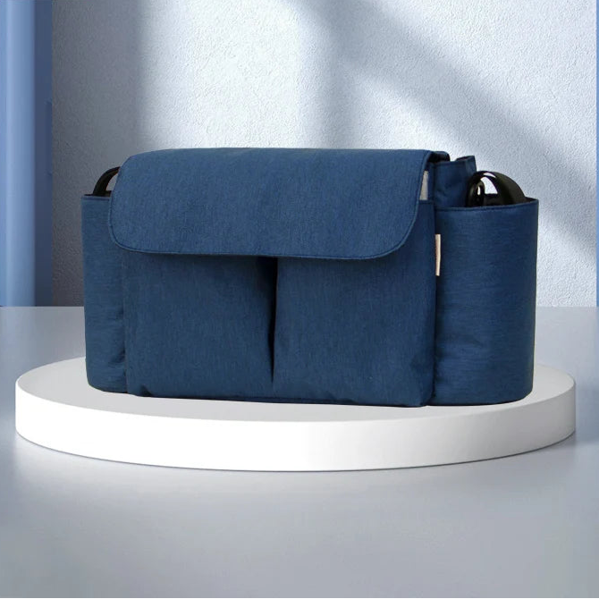 Blue stroller organizer with large capacity and multiple compartments, ideal for parents. Perfect fit for any stroller, offering smart storage solutions.